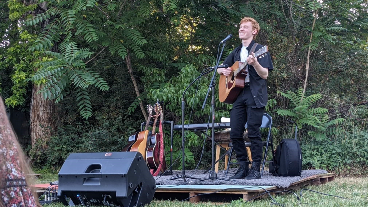 playing guitar on a stage